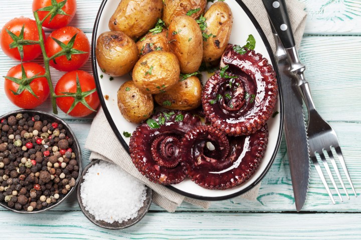 Charred octopus with potato confit and pimentón